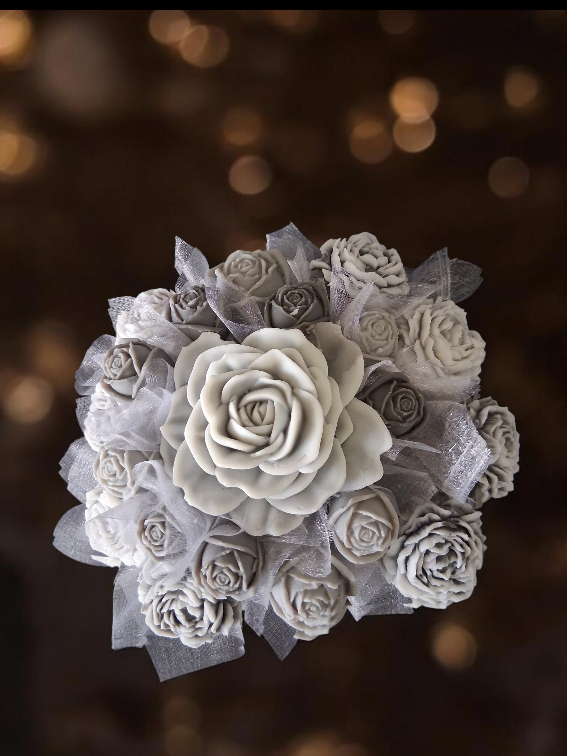 About - Tiny Twinkles - The home of great candles and Melts Grey flower shaped wax melts in a display bucket